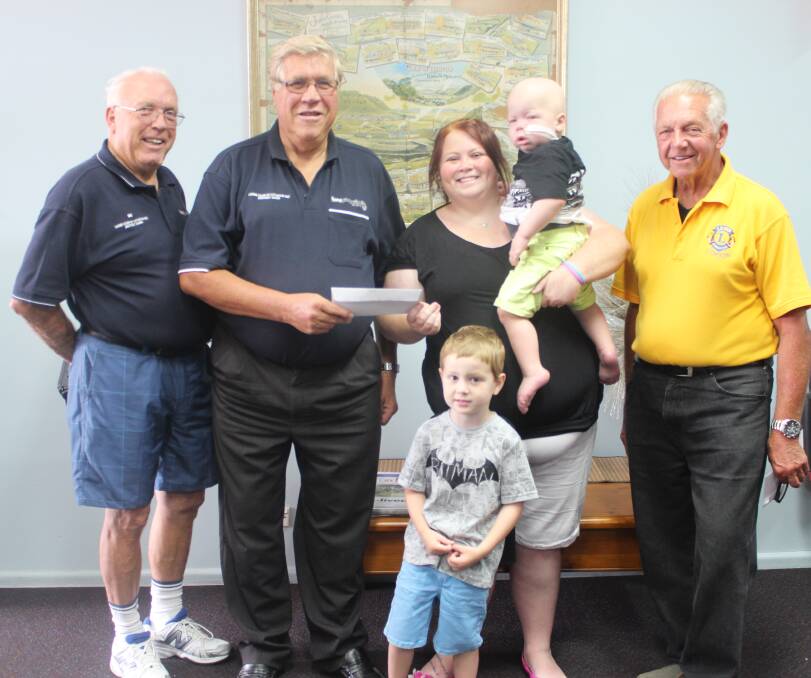 LIONS Bill Neubeck, Alex Roberts and Ken Collins (above) with Lauren Core and sons Kaiden and Paxton. 