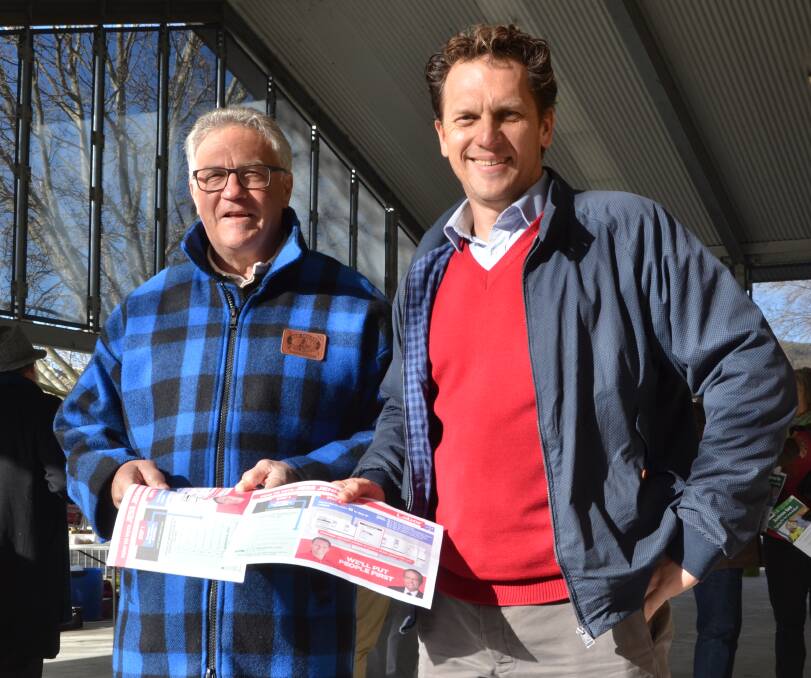 VOTING VOLUNTEERS: Lithgow Councillor Wayne McAndrew and Labor's Calare candidate Jess Jennings handing out how to vote cards at Cooerwull Public School. PHOTO: Jacob Gillard.