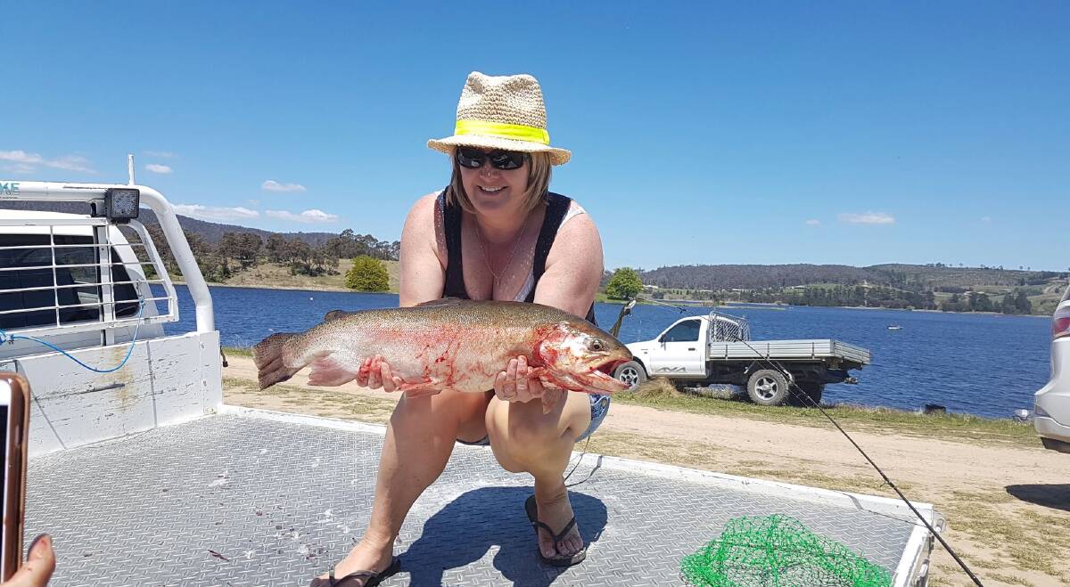 LARGEST TROUT WINNER: Natalie MacCullagh with her first placer 65.5cm rainbow trout. PHOTOS: Supplied.