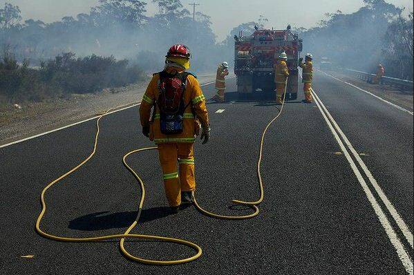 NSW RFS Crews continue to fight the State Mine fire on the Darling Causeway near Bell as they back burn onto the fire front. Photo: Wolter Peeters