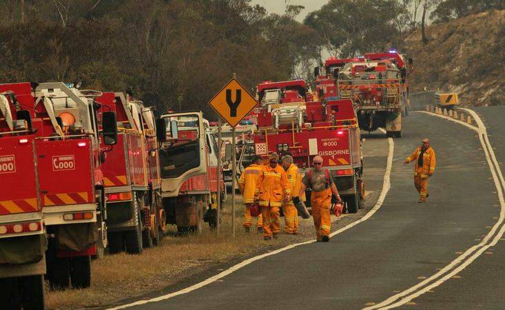 A Rural Fire Service strick team converge on Bells Line of Road near Mt Victoria. Photo: Dean Sewell