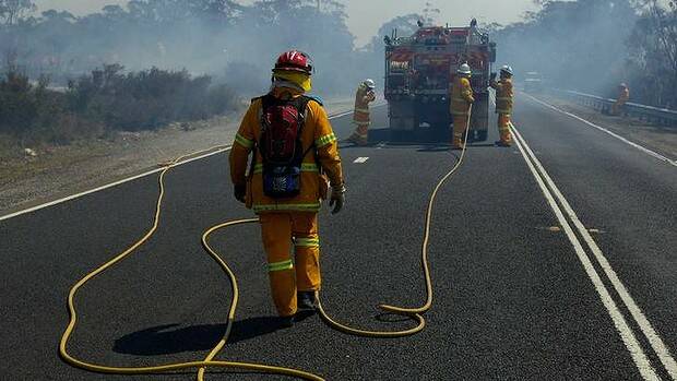NSW RFS Crews continue to fight the State Mine fire on the Darling Causeway near Bell as they back burn onto the fire front. Photo: Wolter Peeters