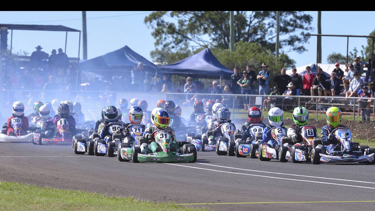 COLOURFUL START: The action packed start at Bundaberg. Photo: ASH BUDD  	lm093013karters