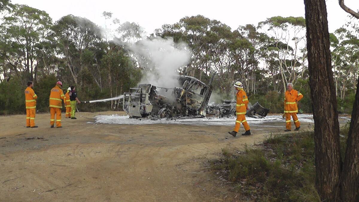 SUSPICIOUS: The burnt out shell of the prime mover stolen from council yards in Mort Street and set alight at the old air strip over the weekend. Photo: ANDREW MICALLEF, Wide Area Communications 	lm021113fire