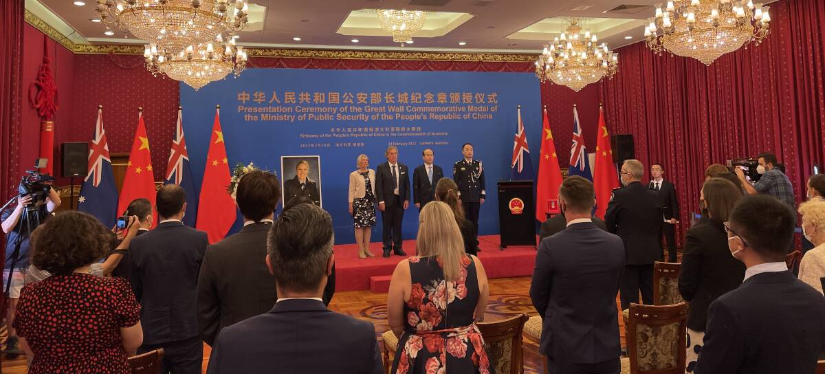 Bravery honoured: Senior Constable Kelly Foster's parents receive a commemorative medal from the Chinese ambassador to Australia. Picture: Supplied