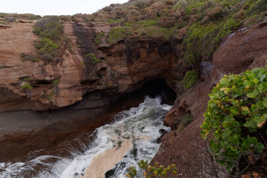 Easter Tragedy: A woman died after she was swept off rocks at the Pink Caves near Catherine Hill Bay on Thursday afternoon. Pictures: Max Mason-Hubers