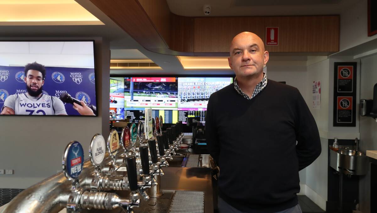 Paddy Coughlan behind the bar at Five Islands Hotel, the pub he bought for $20 million as CEO of an investment group earlier this year. Picture: Robert Peet