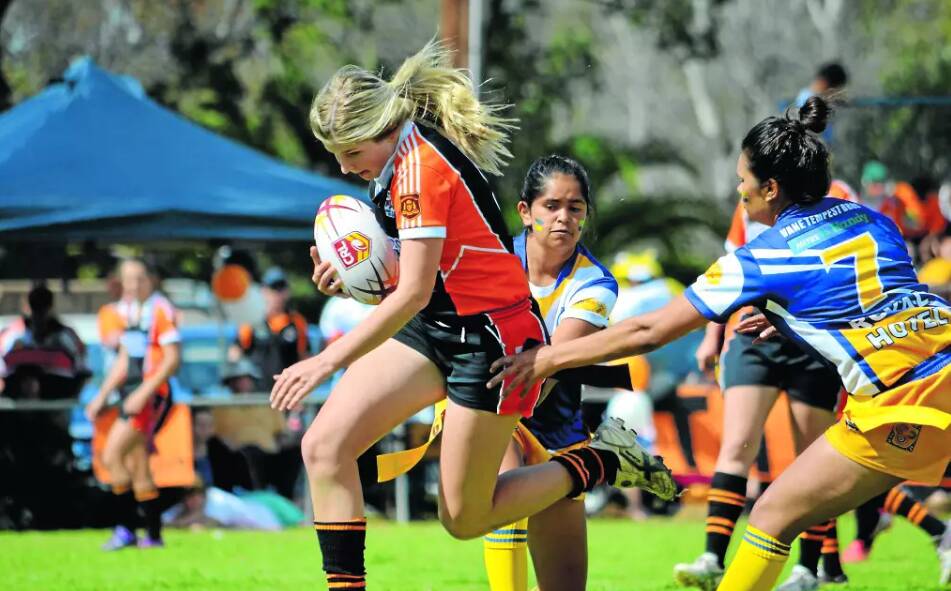 Alicia Earsman tries to split the Condobolin Rams' defence back in 2013 with her Canowindra Tigers squad. File picture 