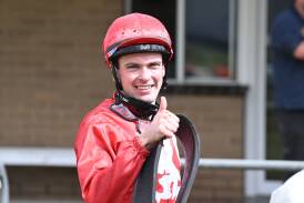 Irish-born jockey Tom Madden gives the thumbs up after a race win. Picture by Racing Photos