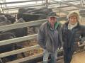 Don and Karen Mills, Corowa, from Rosedale Nominees with their 12 cows with calves that sold for $3860 a unit at Wodonga store sale on Thursday.