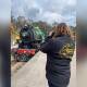 Author Jess Day takes a photo of an oncoming Steam train for her book. Photo: Supplied