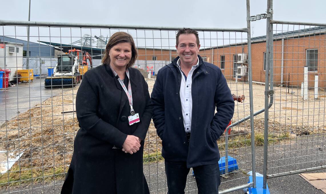 Member for Bathurst, Paul Toole and Hospital general manager Bronwyn Boyling stand in front of the MRI construction site. Photo: Supplied