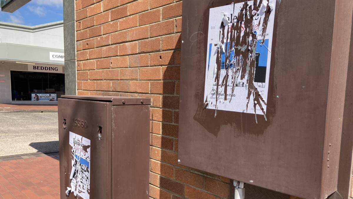 POLLUTION: Someone expressed anger in trying to scrape away unsightly posters in the CBD over Easter.