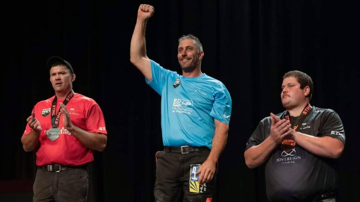 Brad De Losa at the top of the podium alongside Laurence O'Toole (left) and Brayden Meyer (right) at the end of the 2024 Stihl Timbersports Australian Trophy. Picture supplied. 