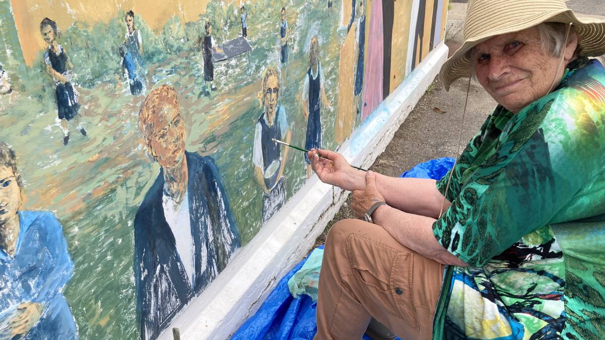 HEATWAVES are no problem for dedicated artists like Ann Christie hard at work this week restoring the Eskbank Street railway bridge murals that were showing the effects of time and weather. The murals are a popular photo opportunity for visitors.