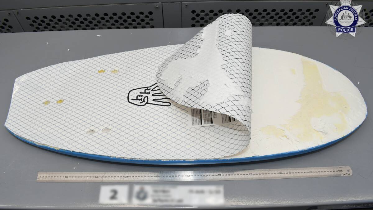 An imported surfboard allegedly packed with meth. Picture via AFP