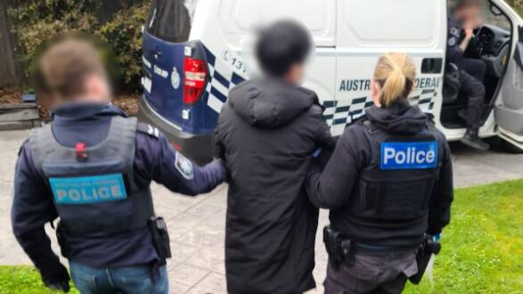 Police arrest a 33-year-old Ferntree Gully man. Picture via AFP