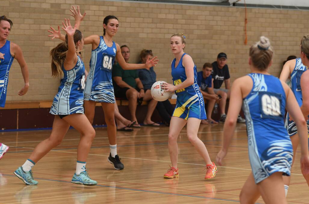 LOOKING FOR SUPPORT: Lithgow's Olivia Kay appears to be surrounded by the Dubbo defensive unit. Photo: CHRIS SEABROOK 030418cnetb6