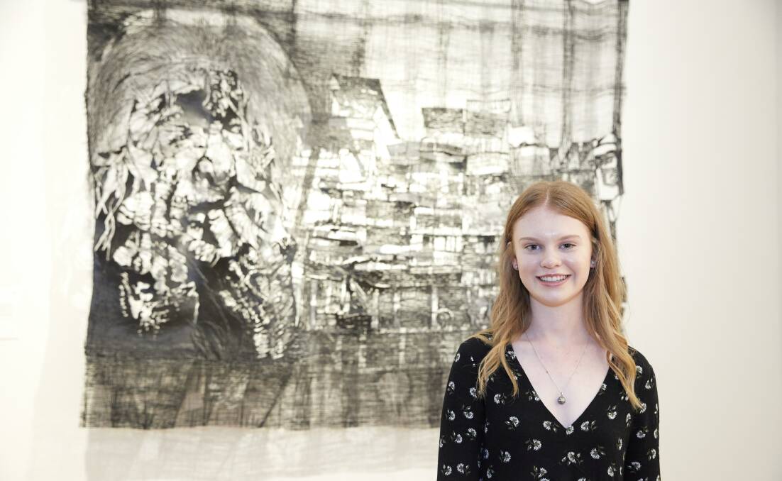 WORK: Lauren Trounce in front of her art work 'The Social Fabric'. Picture: Mim Stirling. 