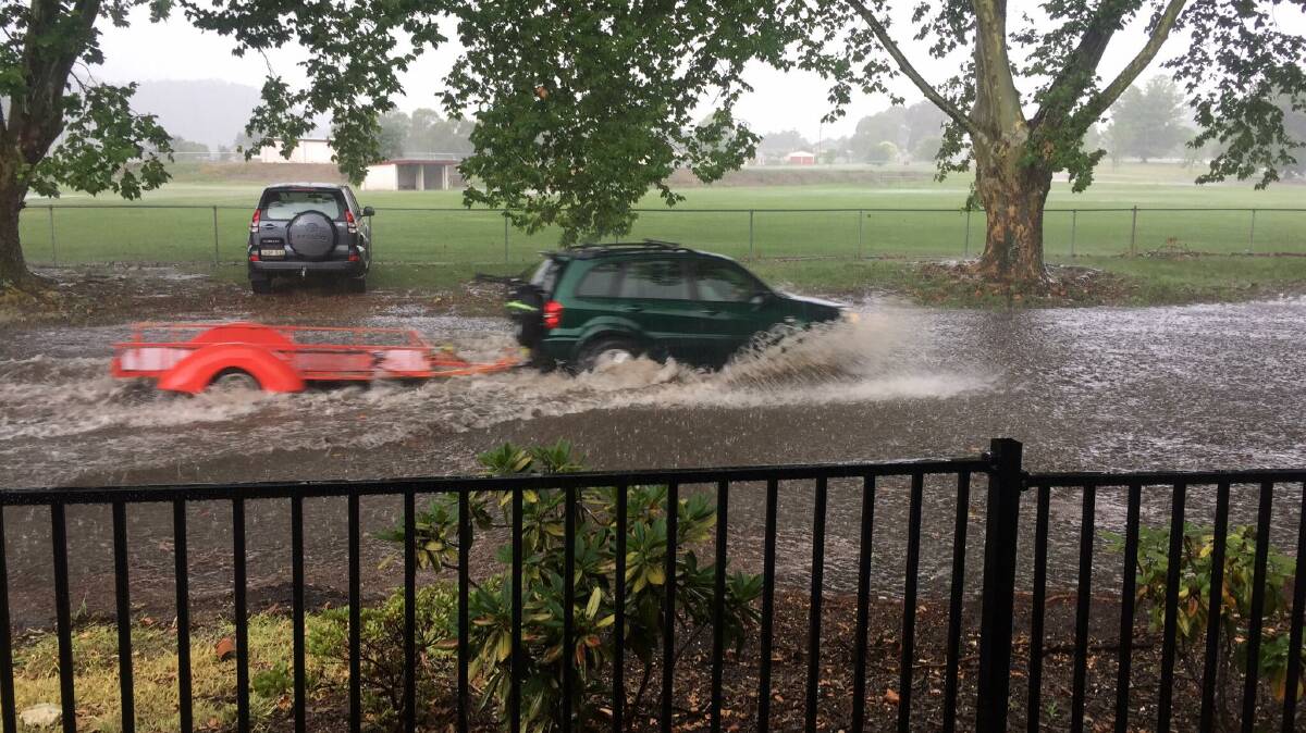 Cars braved the flood water. Picture: Greer Ashworth. 