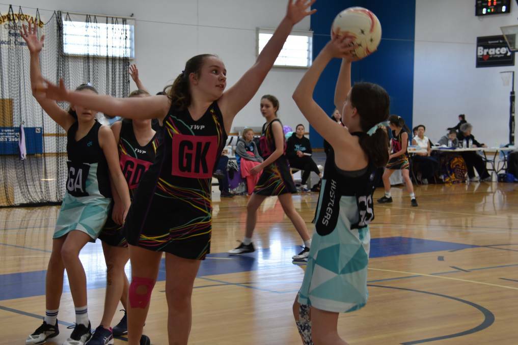 2019 GRAND FINALS: The girls will be eager to hit the courts later this year when it is safe to do so. Picture: KIRSTY HORTON