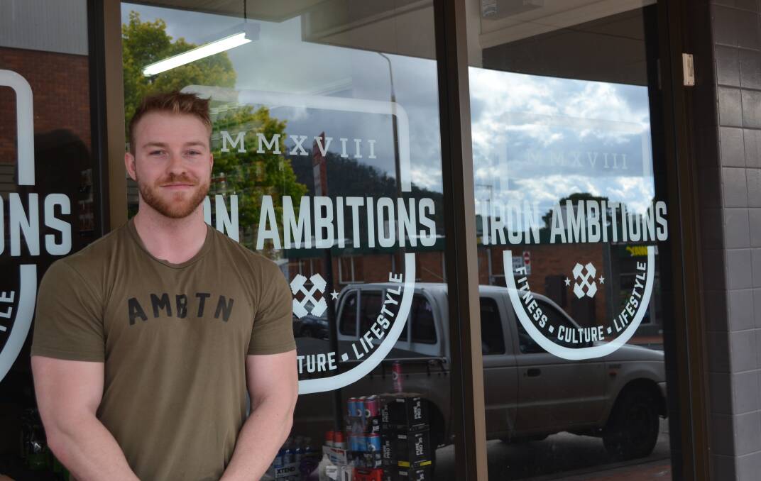 OPEN FOR BUSINESS: Nathan Swan out the front of his store on Main Street. Photo: CIARA BASTOW 