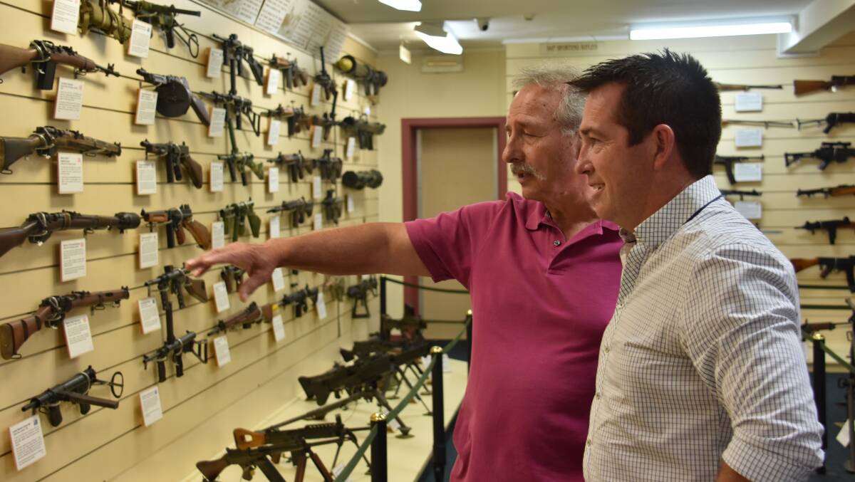 MP Paul Toole admiring the weapons in the museum as Renzo Benedet describes the history. 