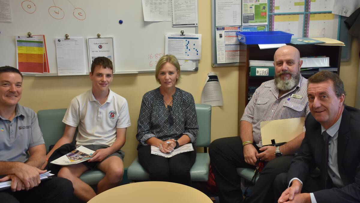 SIGN: Craig Leet, Noah Nugent, Michelle Nugent,  Workies Operations Manager Shane Wade and Mr Borham all being present for the final sign up of the traineeship. 