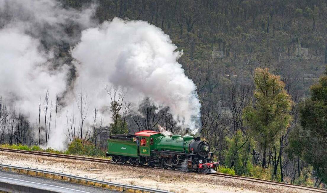  ALIVE AGAIN: Steam covered the air as the locomotive went around the tracks. Photo: CHRIS LITHGOW