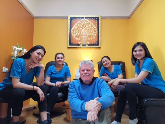 SAMSARA: Business owner Phil Fisher with his wife and fellow employees at the massage parlour. Picture: SUPPLIED 
