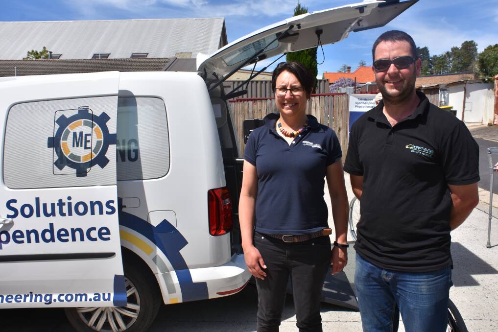 CAR MODIFICATION: Sally Webb and Aaron Faulds were excited to team up to show Lithgow residents what new technology is available. Picture: CIARA BASTOW. 