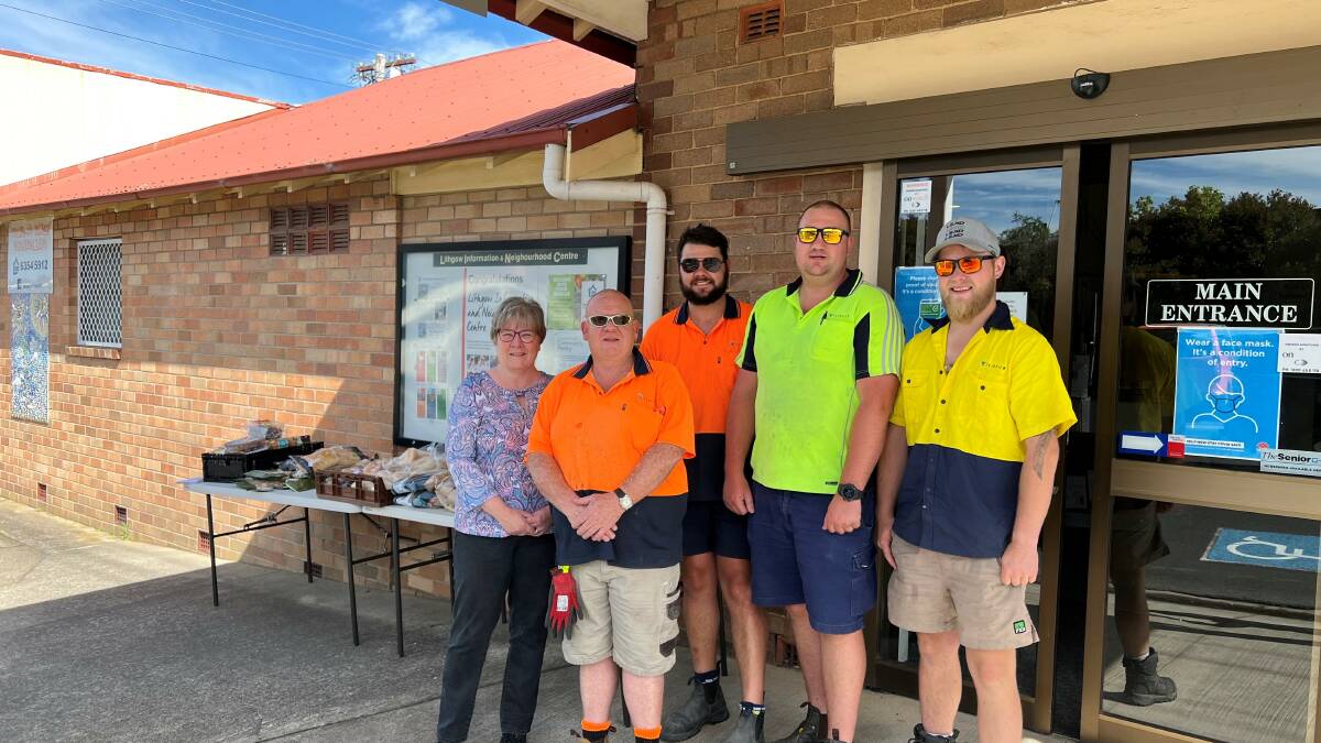 HELPING HAND: Bradley Preston, Brayden McPaul, Brody Roy and Stephen Bevear with LINC's Leanne Walding. Picture: SUPPLIED 