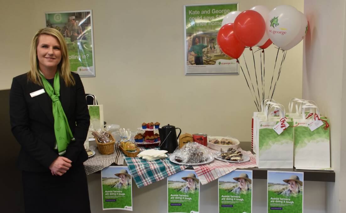 Branch manager Stacey Cameron in front of the morning tea St George bank put on to raise money for farmers. 