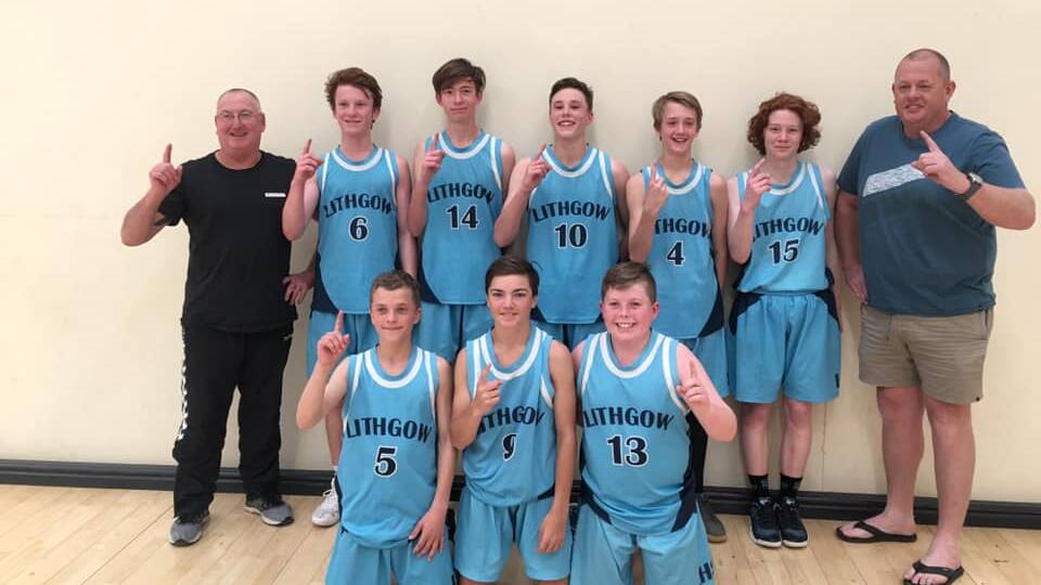 WINNERS: The under 15's boys took home the title of Western Champions, with coaches Gary Inwood and Gary Wallace. Picture: SUPPLIED