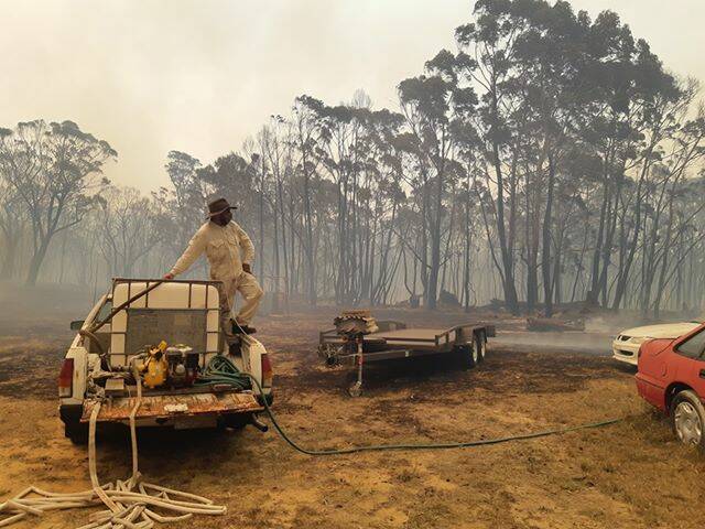 Mr Sammut helping put out spot fires with his Ute. 