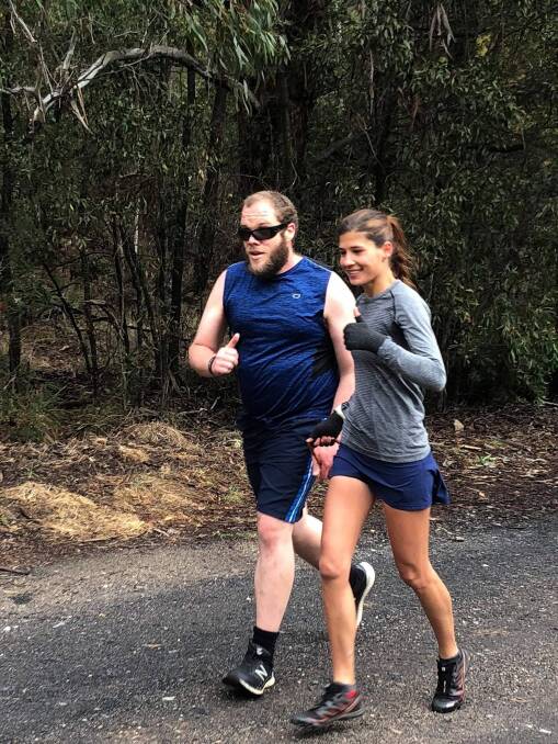 RUNNERS: Anthony Mahr being guided by runner Florentina Dulceanu at Lithgow park run. Picture: SUPPLIED. 