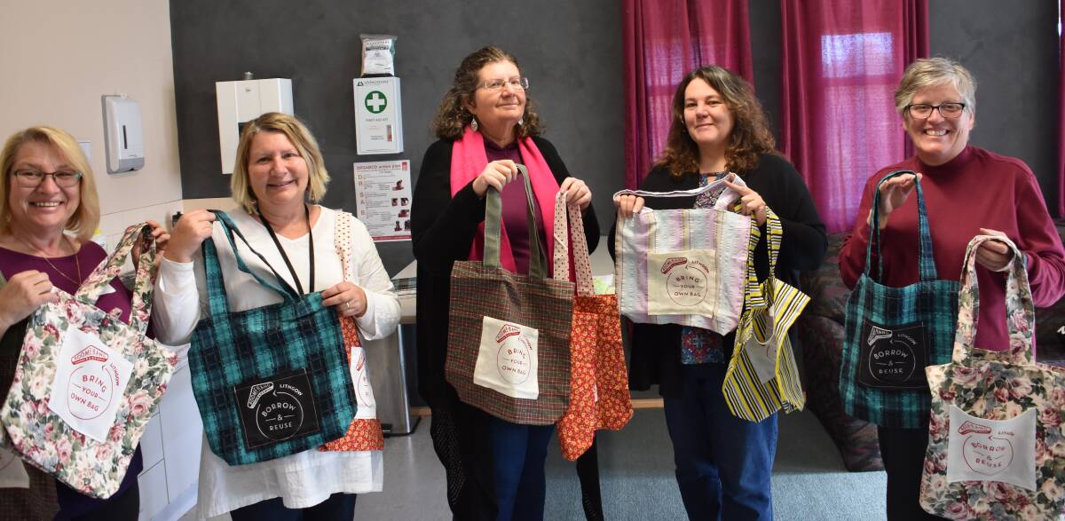 CREATIVE BAGS: Carol Stevens, Debbie Bailey, Amanda Horner, Deb Oakley and Allyn Jory show off some of the bags they have created with second hand material. Picture: CIARA BASTOW. 