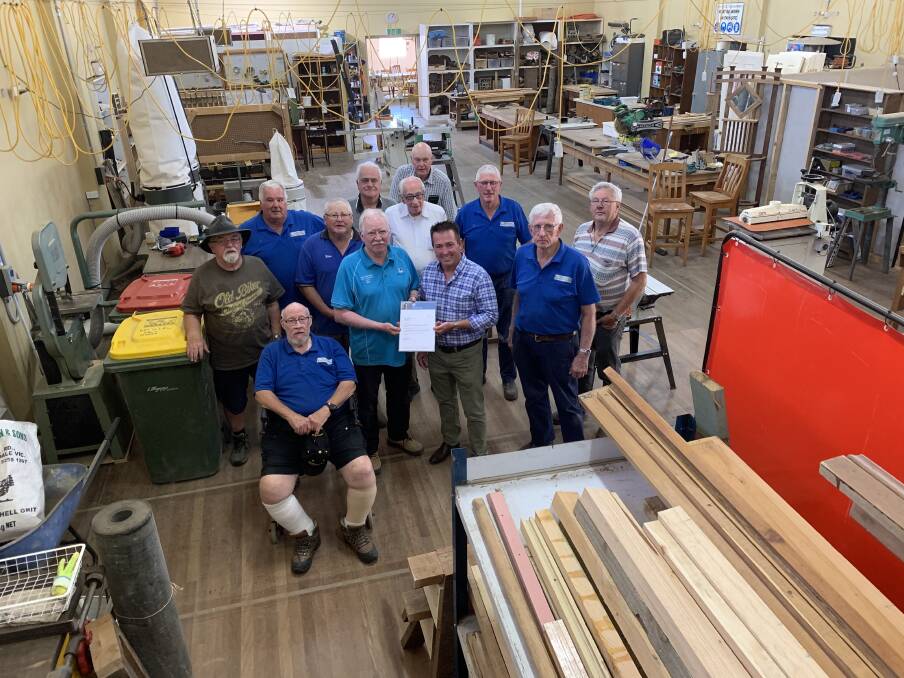 
Bathurst MP Paul Toole has surprised members of the Wallerawang Mens Shed with a visit to inform them they would be receiving special funding of $4300 to buy new equipment for their workshop. Picture: SUPPLIED 
