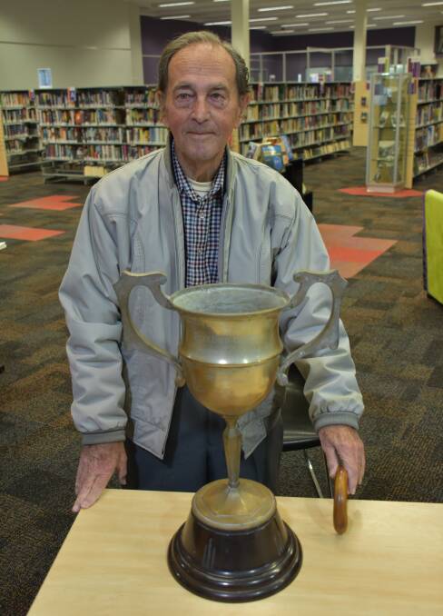 CUP: Leon Bizannes with the cup his father donated. 