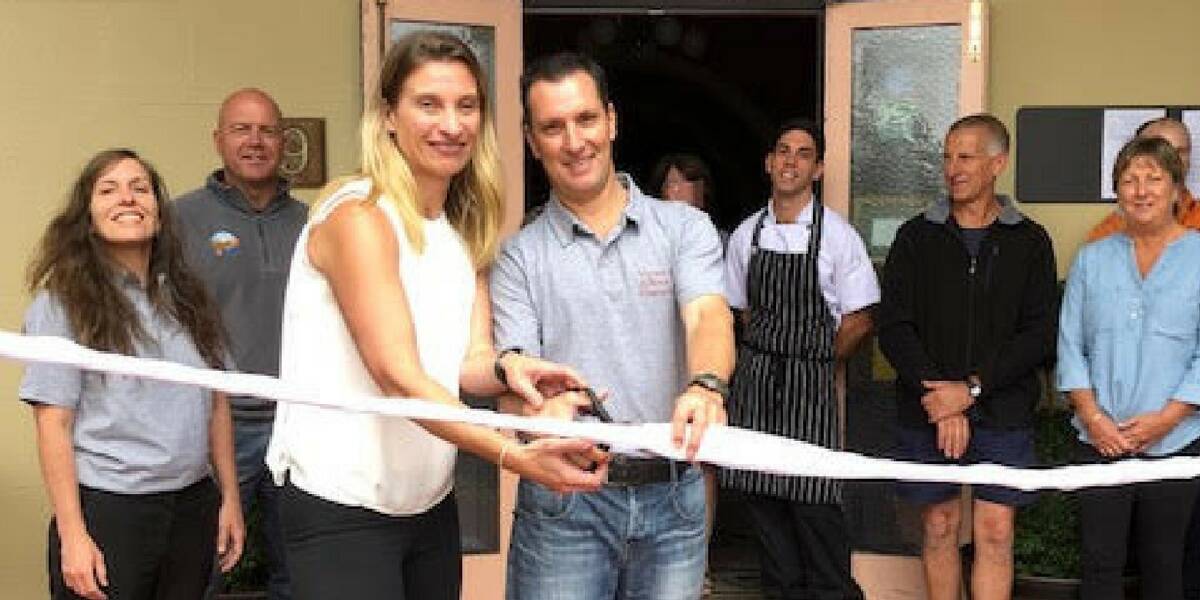 OPEN FOR BUSINESS: Tania Wiseman and partner Wayne Thompson officially open the Victoria and Albert Guesthouse surrounded by friends, family and colleagues. Picture: SUPPLIED.  