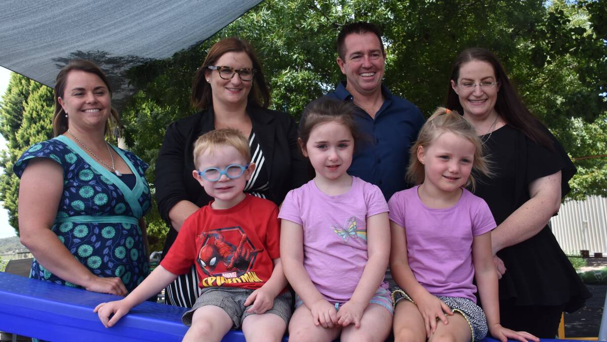 Director Anita Van Den Berg, Minister for Early Childhood Education Sarah Mitchell, MP Paul Toole and president of management committee Brooke Coolidge with some of the happy students, Sam, 4, Geneveive, 4, and Nevaeh, 4. 