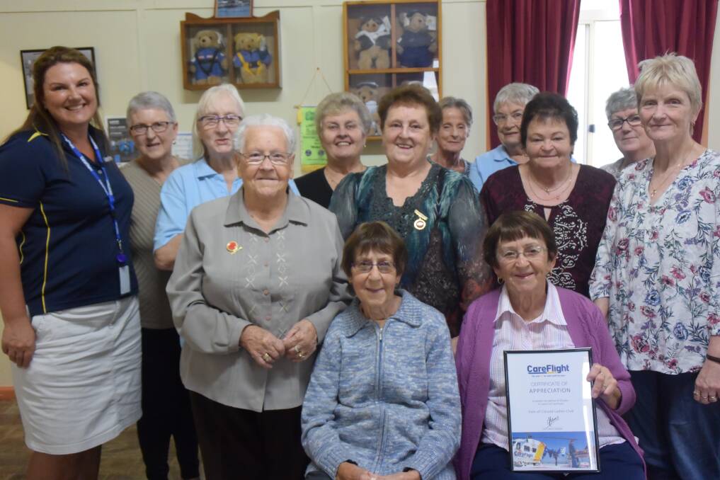 VALE LADIES: The ladies gather with CareFlight relationship development officer Sharon Debevc to show off their 20 years of support certificate. Picture: CIARA BASTOW. 