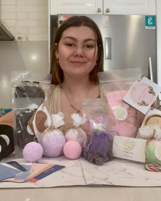 SELF LOVE: Taylah Jayde Thompson with her 'Hello Happy Me' products. Picture: SUPPLIED 