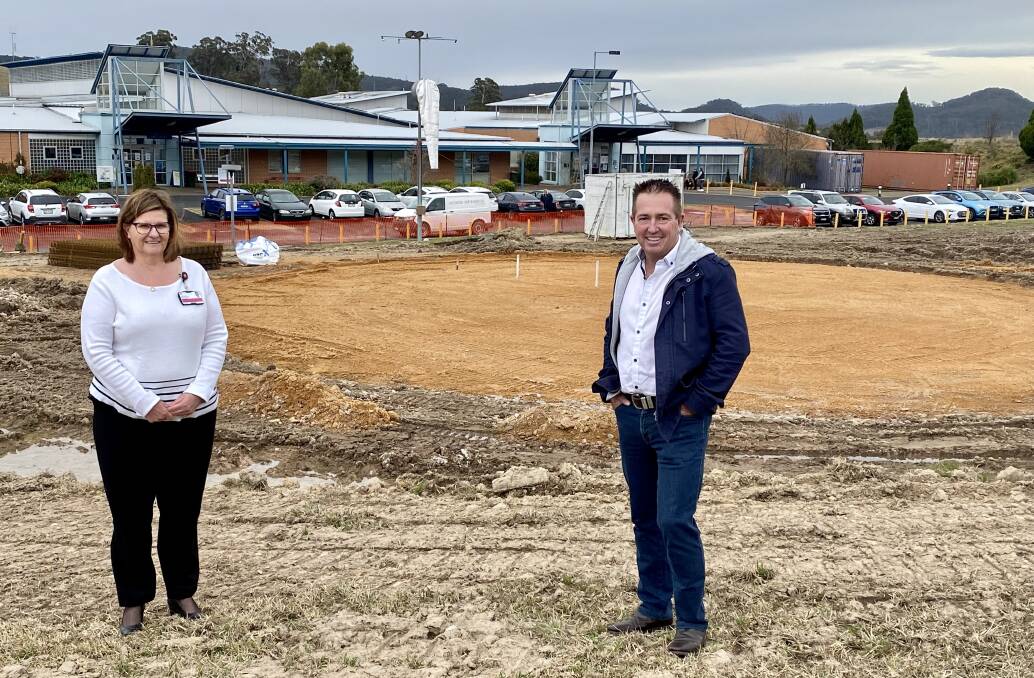 NEW HELIPAD: Member for Bathurst Paul Toole and Lithgow Hospital acting general manager Bronwyn Boyling on site at Lithgow Hospital where construction has started on a new helipad. Photo: SUPPLIED 