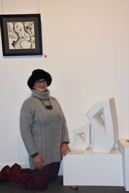 SCULPTURE: Kay Booker with her two works, including her highly commended sculpture. Picture: CIARA BASTOW. 