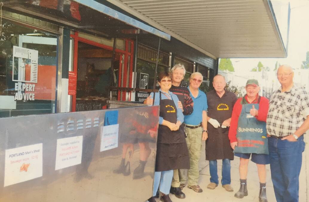 Men and women from the Portland Men's Shed doing their barbecue at Bunnings. Picture: SUPPLIED