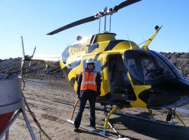 FUN: Diana Barnes standing in front of a helicopter before her first trip up in the air. Photo: SUPPLIED 