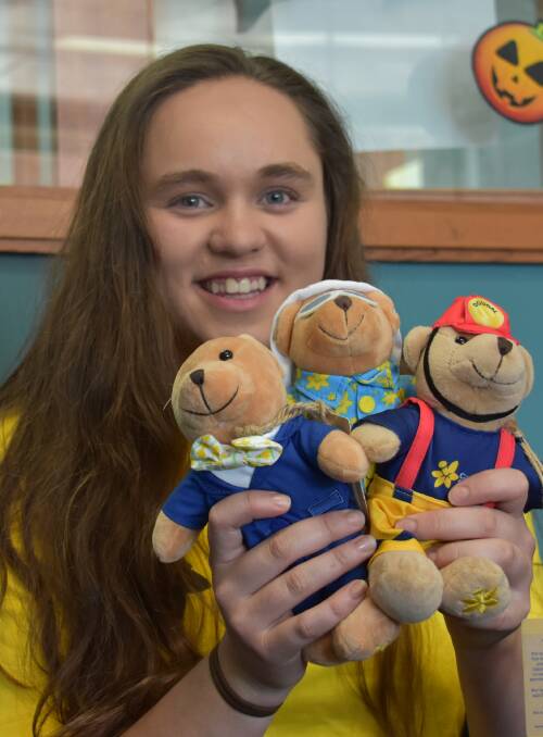 VOLUNTEER: Keen volunteer Emily Waru with some Daffodil Day mascots. Picture: CIARA BASTOW. 
