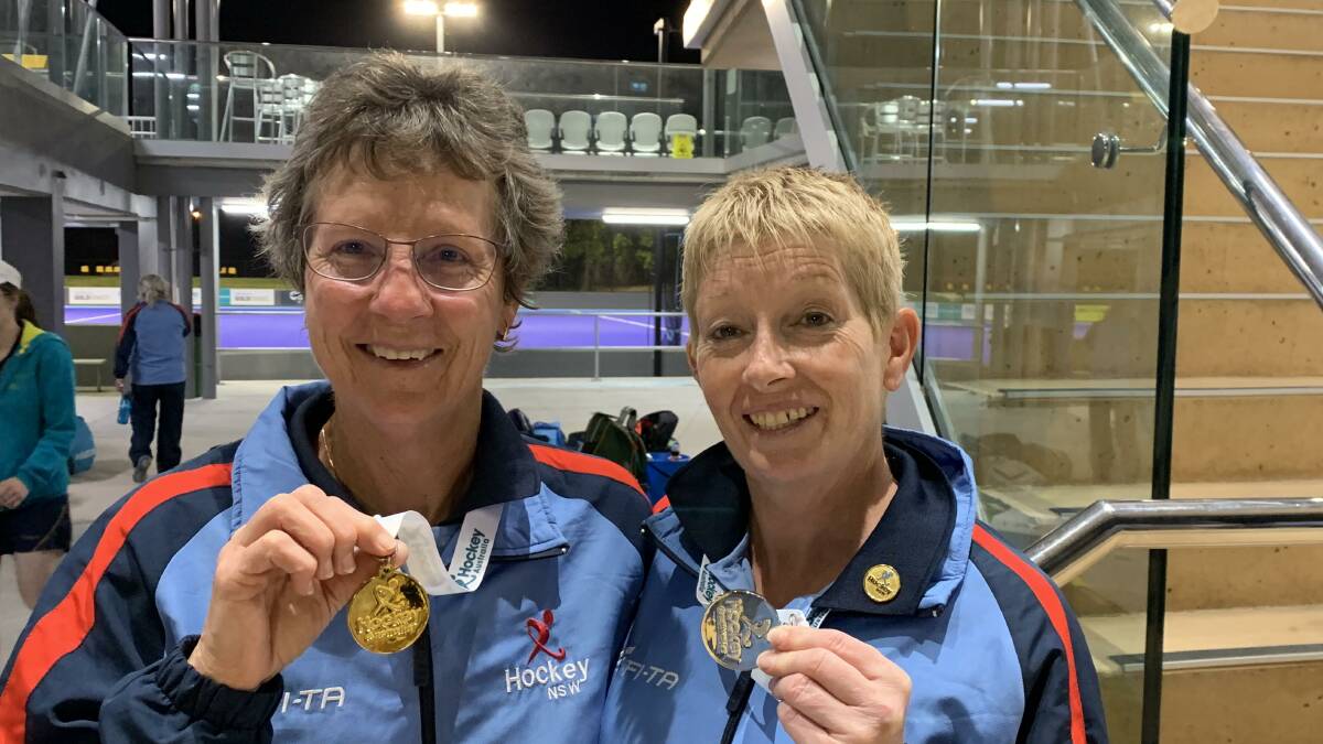 FRIENDSHIP: Hockey players Cheryl Rutherford and Tracey Baker brought home the silverwear from the National Masters competition. Picture: SUPPLIED. 