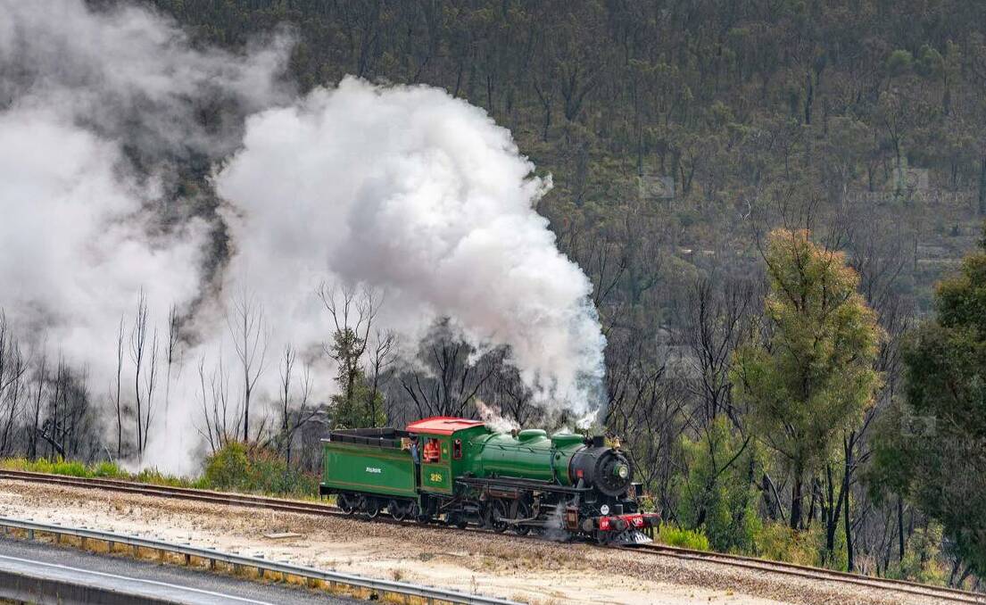 ALIVE AGAIN: Steam covered the air as the locomotive went around the tracks. Photo: CHRIS LITHGOW